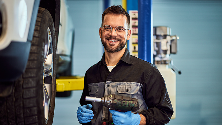 Fleet tech working on a car