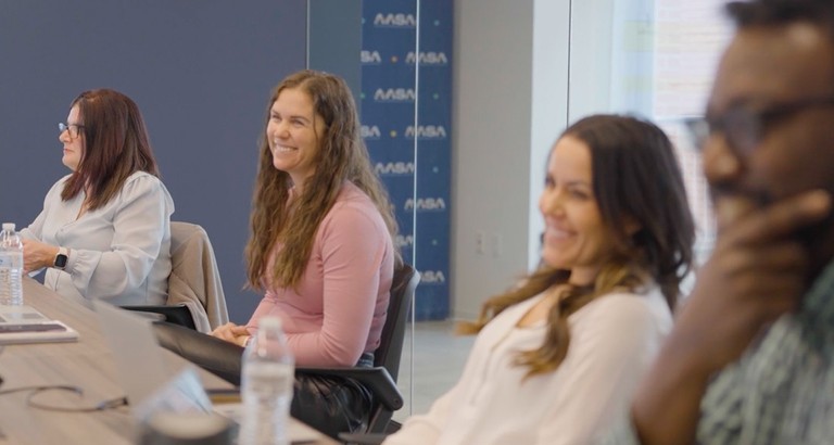 adults sitting at table during a meeting