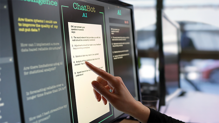 Someone using a chatbot kiosk