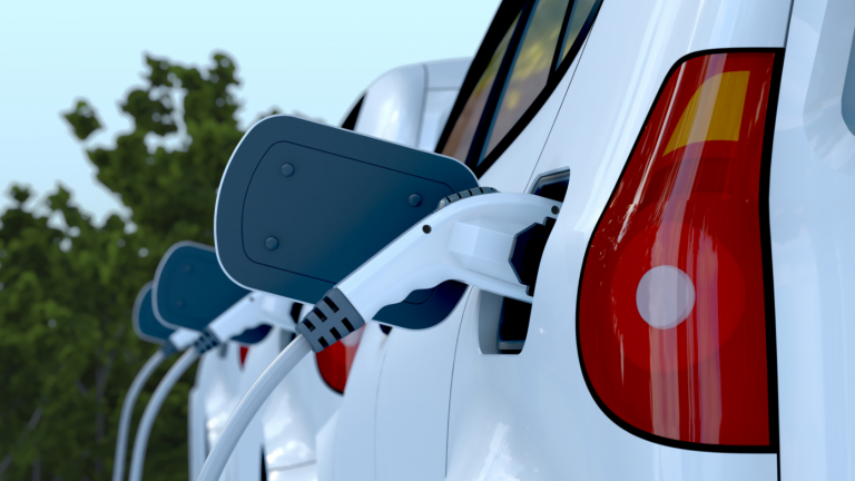 Close up image of white electric vehicle charging
