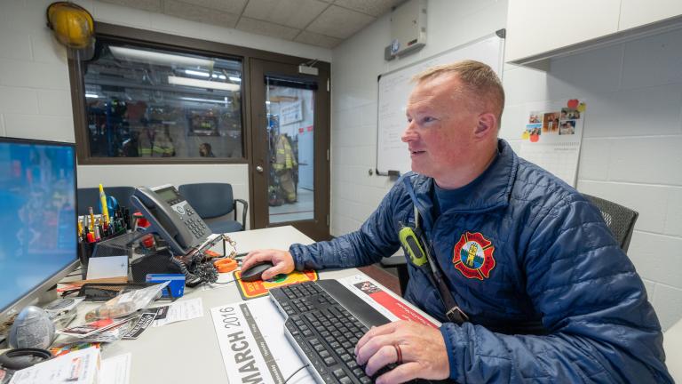 Fire chief working on computer